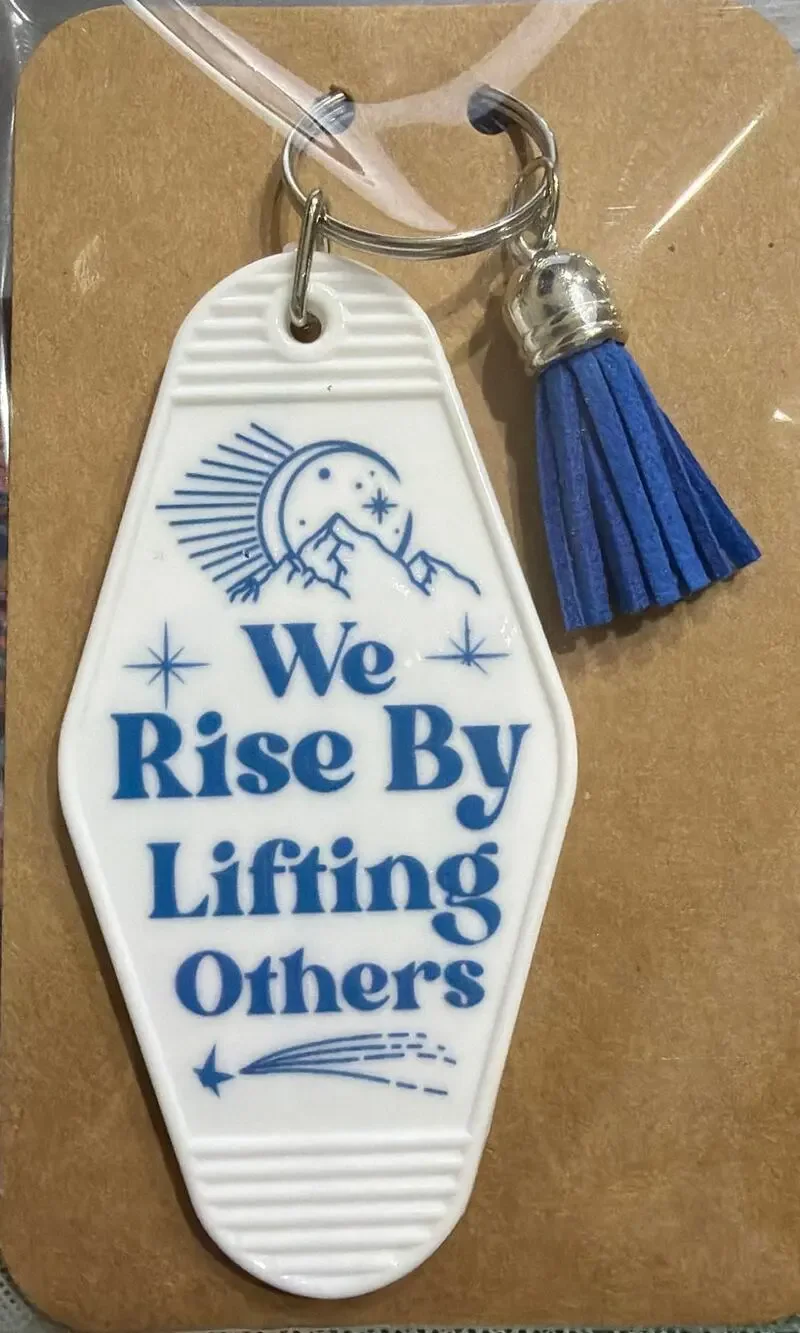 We Rise By Lifting Others White & Blue Tassel Vintage Hotel Motel Keychain